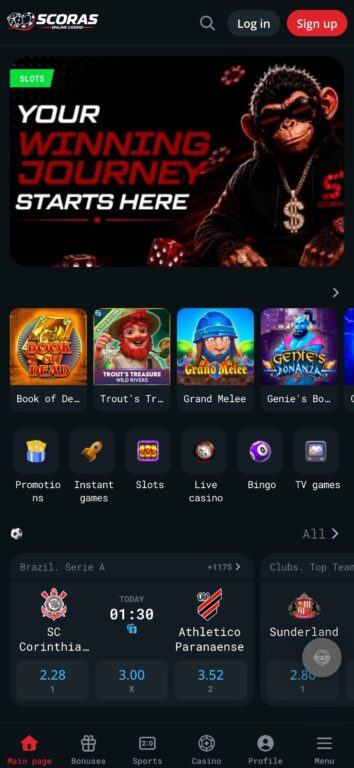 Scoras online casino mobile homepage showing the Mojo monkey welcome banner, featured slots, game category shortcuts, and live football odds with a bottom navigation bar